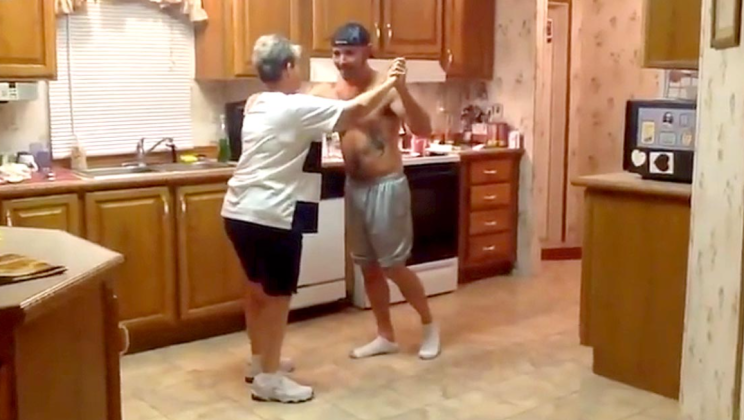 Son took his mother’s hand when the favorite song began to play – now watch the dance that conquered the internet by storm